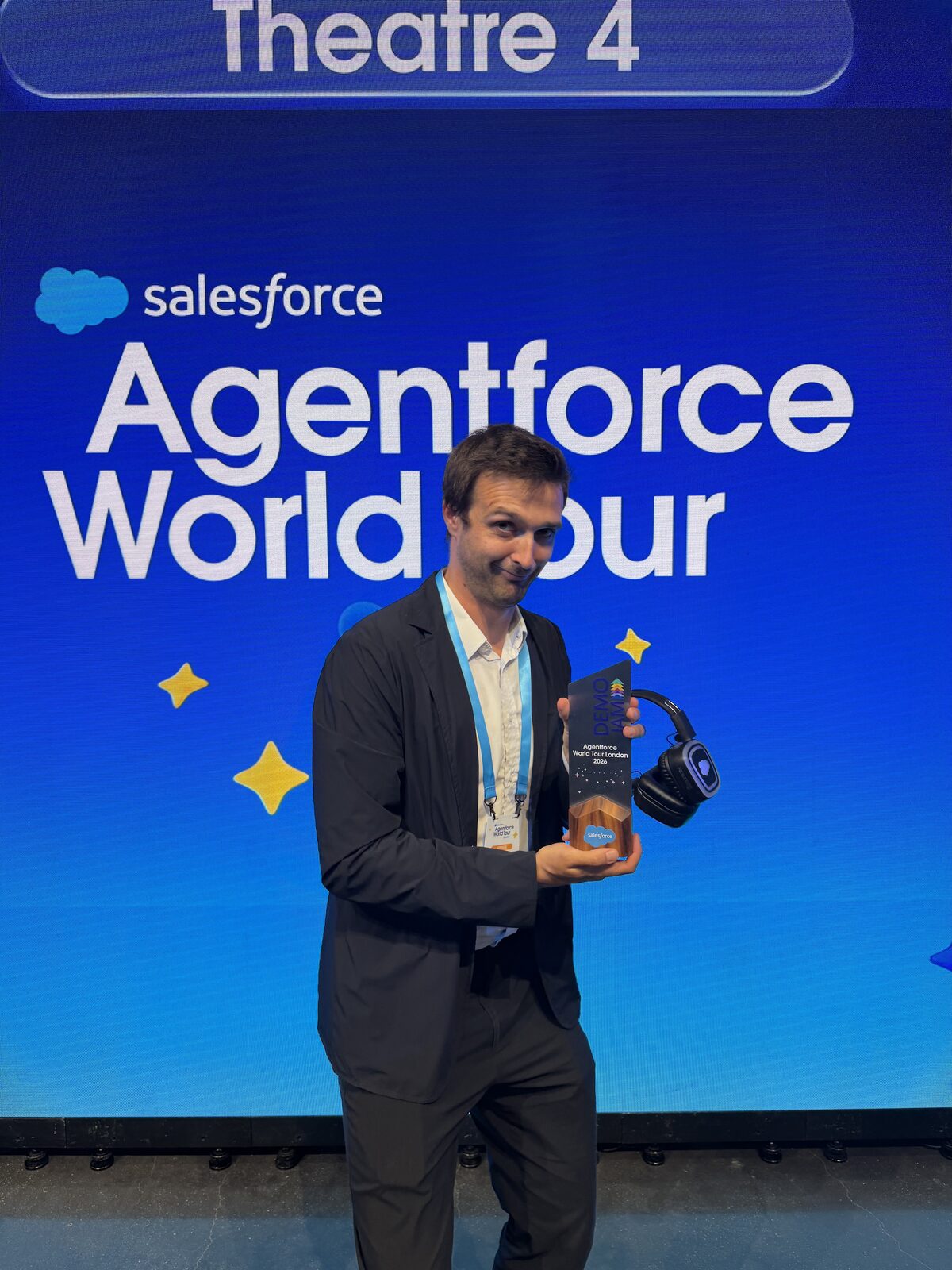 ARPEDIO's Demo Jam trophy from the Salesforce Agentforce World Tour London 2026, held in front of the event stage backdrop