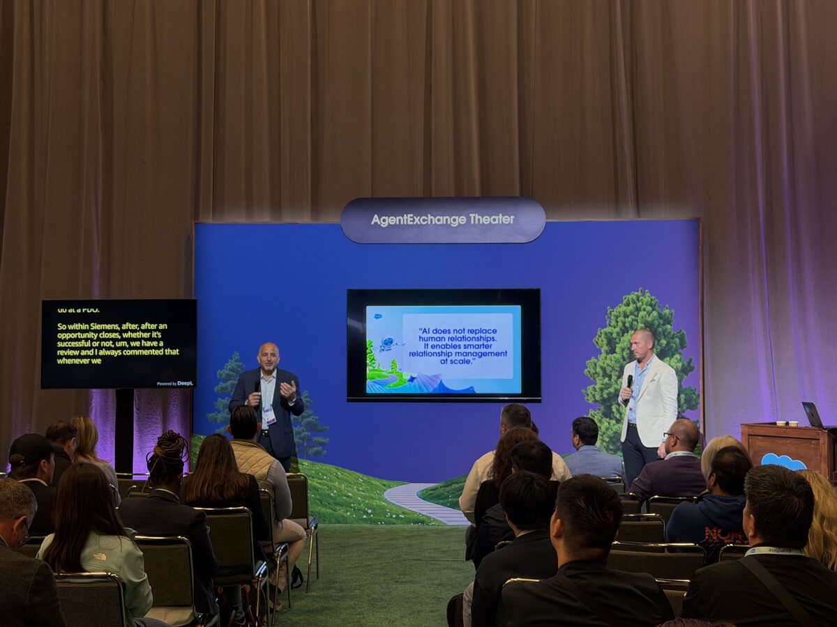 Siemens and ARPEDIO on stage in the AgentExchange Theater at Dreamforce 2026 for theater session 1982, with a full audience